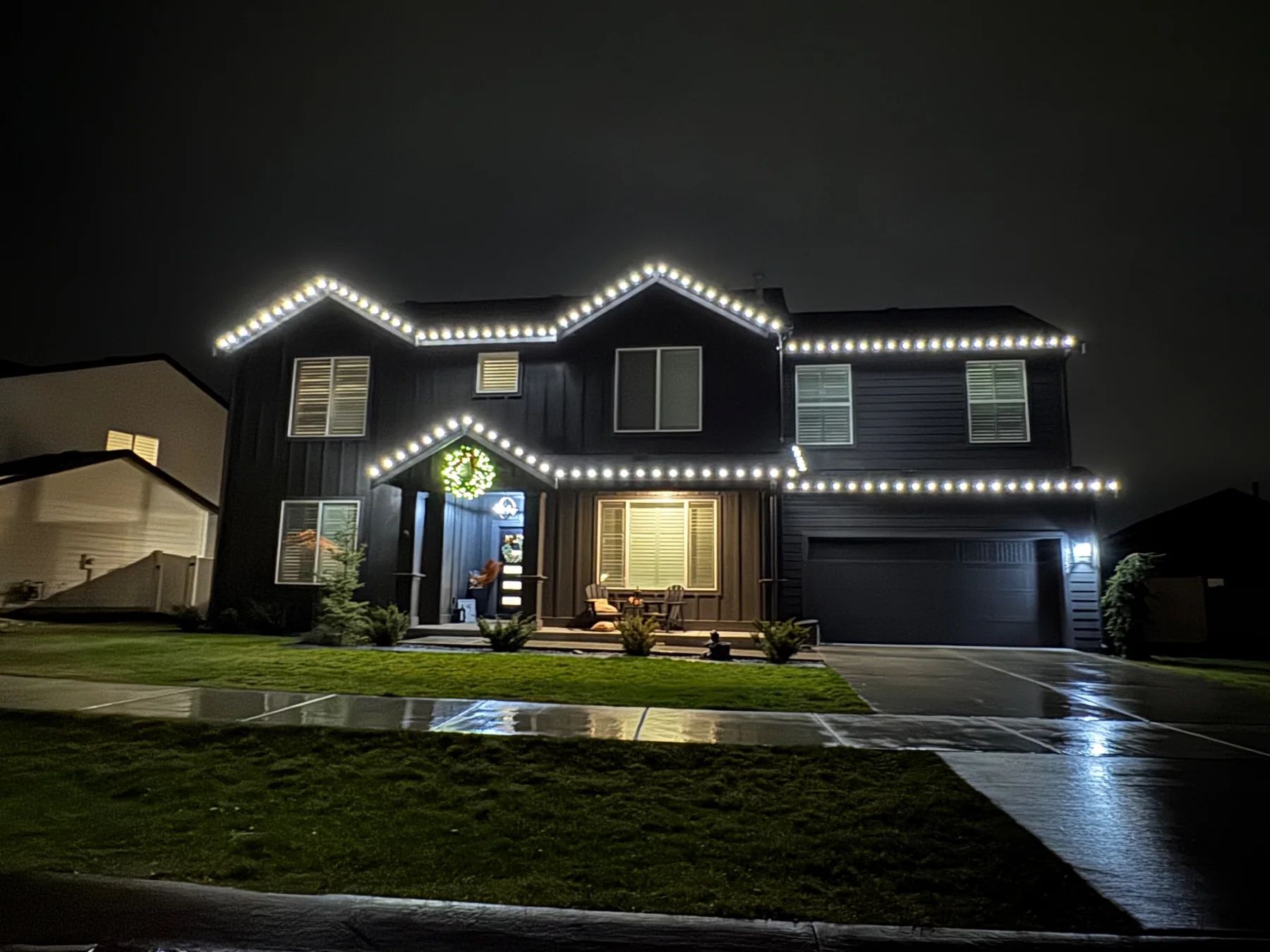 Pure white Christmas lighting on a two-story home